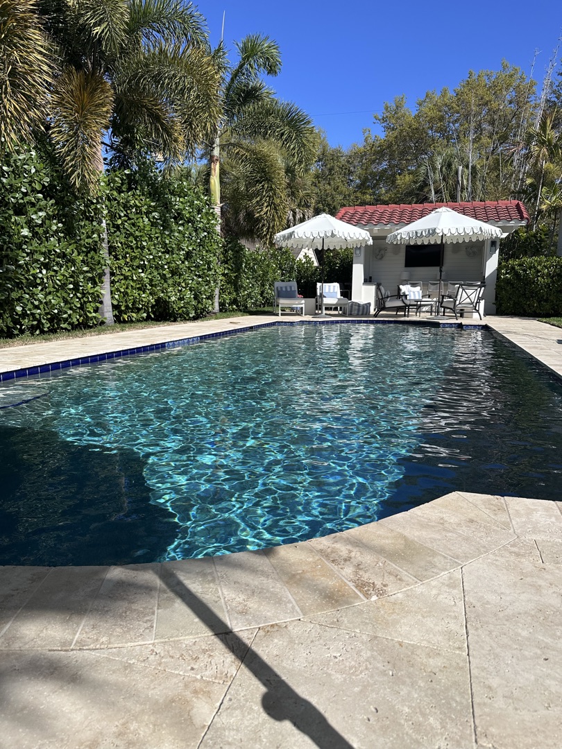 Backyard pool on a sunny Florida day — clean, clear, and ready to use