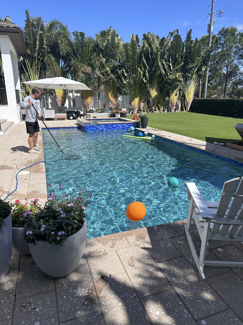 Pool technician servicing a residential pool in Pinellas Park FL — Sunshine Pool Group